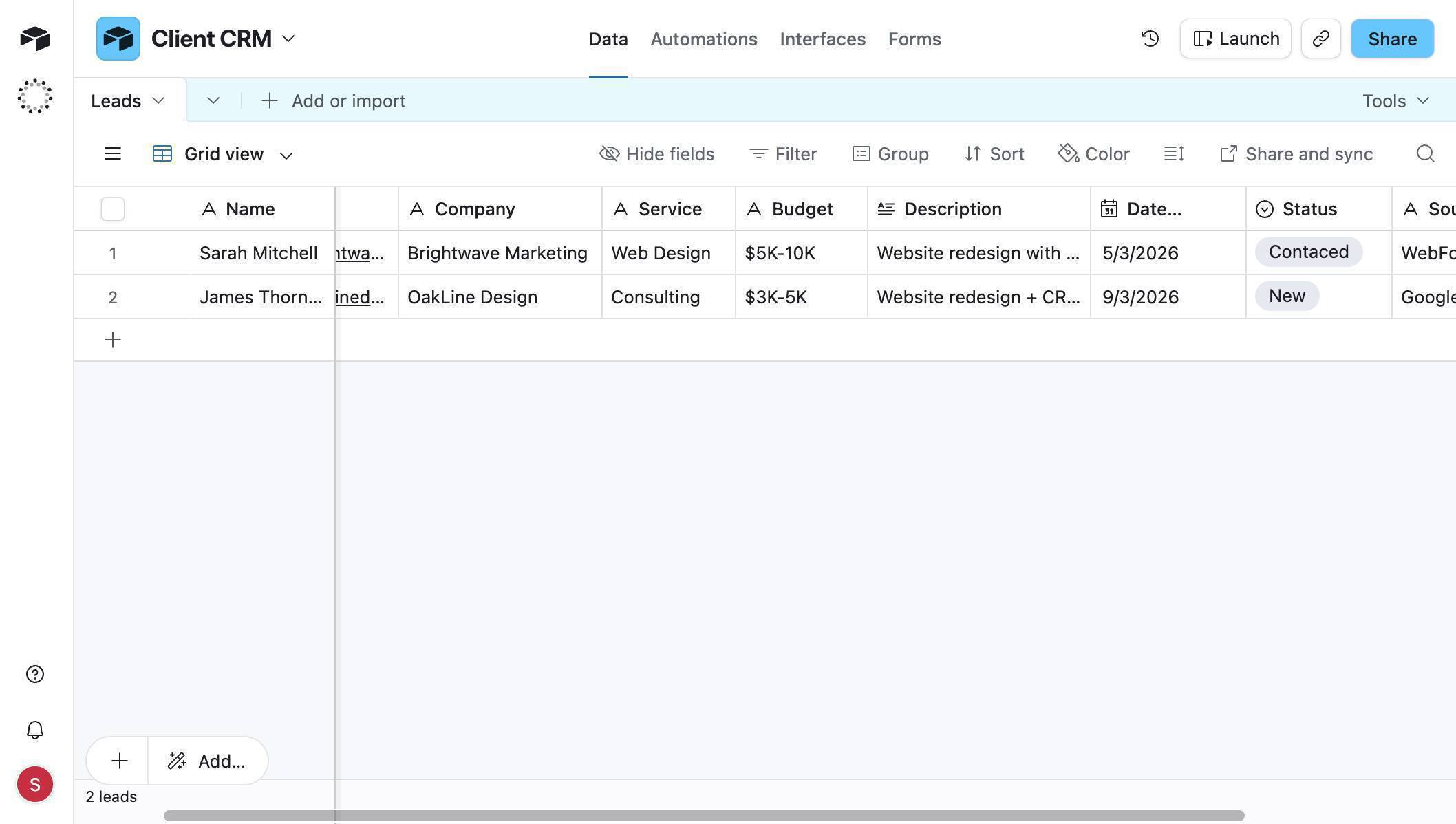 Airtable Client CRM — two lead records auto-populated from Google Forms submissions