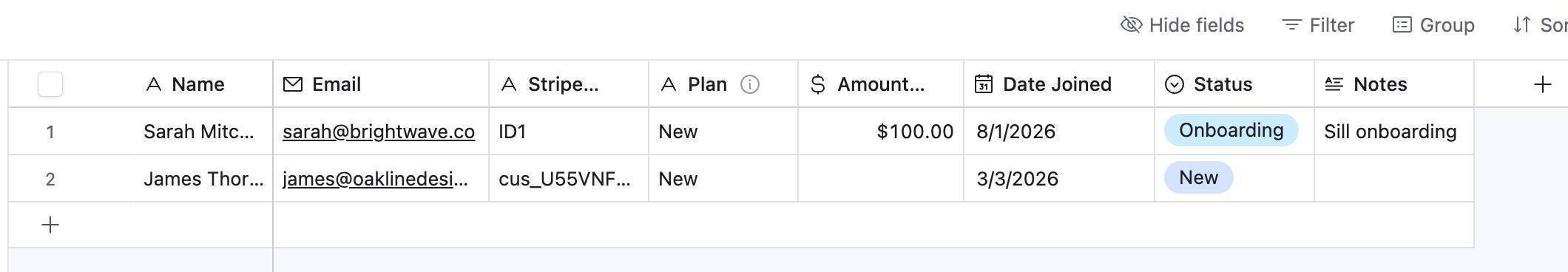 Make.com Stripe automation result — Airtable Client Tracker with auto-populated client row